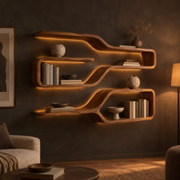 Three looped wood shelf frames that narrow like bottle necks in a dark living room at golden hour