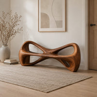 Bow tie bench with two large open loops and a thick smooth frame in a Scandinavian entryway with white walls
