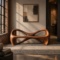 Bow tie bench with two large open loops and a thick smooth frame in an industrial loft entryway with exposed brick