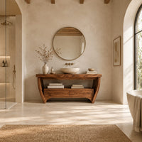 Wooden bathroom vanity on bowed legs with an open lower shelf in a bright open plan bathroom