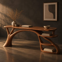 Desk with an arched branch leg and open shelf loops at one end, three-quarter view showing the grain