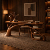 Desk with an arched branch leg and open shelf loops at one end in an evening home office with walnut wall paneling