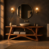 Bathroom vanity on a branching wood base with a plank top and low shelf in a dark bathroom at golden hour