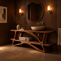 Bathroom vanity on a branching wood base with a plank top and low shelf in an evening bathroom with walnut wall paneling