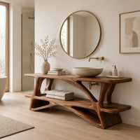 Bathroom vanity on a branching wood base with a plank top and low shelf in a Scandinavian bathroom with white walls