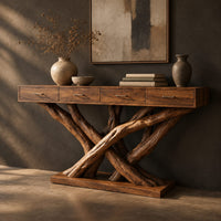Console table with four slim drawers on a base of crossed tree branches, three-quarter view showing the grain