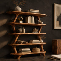 Corner detail of bookshelf with five wide open shelves held by slim branch shaped uprights beside wood, brass and linen samples
