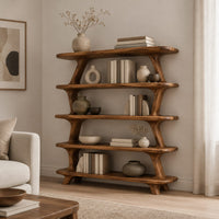 Bookshelf with five wide open shelves held by slim branch shaped uprights in a Scandinavian living room with white walls