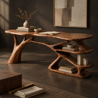 Corner detail of writing desk with a branch shaped leg and stacked open shelves beside wood, brass and linen samples