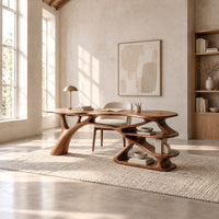 Writing desk with a branch shaped leg and stacked open shelves in a bright open plan home office