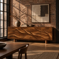 Carved branch sideboard with four flush panels and short cylindrical feet in an industrial loft dining room with exposed brick