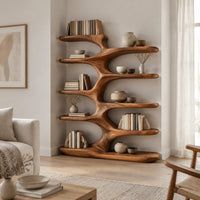 Branching bookshelf with wide sculpted shelves that alternate left and right in a Scandinavian living room with white walls