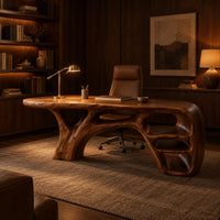 Sculpted wooden desk with branching legs and open shelves at one end in an evening home office with walnut wall paneling