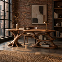 Desk with branching root base, freeform top and open lower shelf in an industrial loft home office with exposed brick