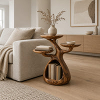 Tree shaped side table with three disc tops and an open base hollow in a Scandinavian living room with white walls