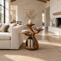 Tree shaped side table with three disc tops and an open base hollow in a bright open plan living room