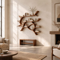 Wall shelves shaped like a forking tree branch with many open levels in a bright open plan living room