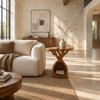 Side table with twin lobed tops on branching limbs above an open base in a bright open plan living room