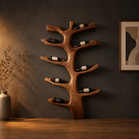 Branching tree wine rack with angled arms that cradle bottles in a dark studio against a charcoal plaster wall