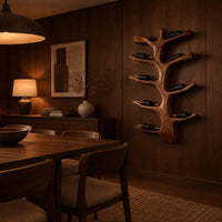 Branching tree wine rack with angled arms that cradle bottles in an evening dining room with walnut wall paneling