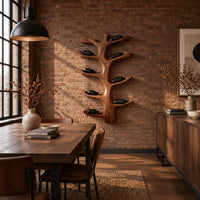 Branching tree wine rack with angled arms that cradle bottles in an industrial loft dining room with exposed brick