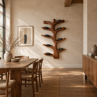 Branching tree wine rack with angled arms that cradle bottles in a bright open plan dining room