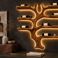 Corner detail of branching tree wine rack with wide shelf arms and a root shaped foot beside wood, brass and linen samples
