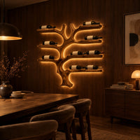 Branching tree wine rack with wide shelf arms and a root shaped foot in an evening dining room with walnut wall paneling