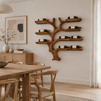 Branching tree wine rack with wide shelf arms and a root shaped foot in a Scandinavian dining room with white walls