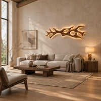 Branching wall sconce with open cutouts and a warm glow behind the wood in a bright open plan living room