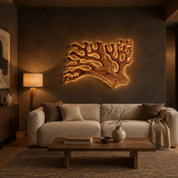 Branching wall sconce shaped like coral with a warm glow behind its edges in a dark living room at golden hour