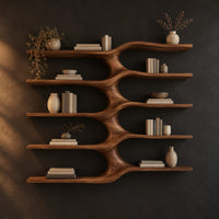 Five stacked wall shelves joined by a central branching stem in a dark studio against a charcoal plaster wall