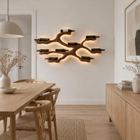 Branching wood wine bottle holder with a cradle at each branch tip in a Scandinavian dining room with white walls