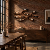 Branching wood wine bottle holder with a cradle at each branch tip in an industrial loft dining room with exposed brick