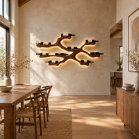 Branching wood wine bottle holder with a cradle at each branch tip in a bright open plan dining room