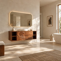 Floating vanity with carved breaking wave fronts and open cubbies at both ends in a bright open plan bathroom