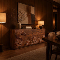 Sideboard with a carved breaking wave across the doors in an evening dining room with walnut wall paneling