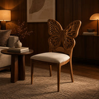 Chair with a pierced butterfly wing backrest and padded seat in an evening living room with walnut wall paneling