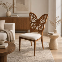 Chair with a pierced butterfly wing backrest and padded seat in a Scandinavian living room with white walls