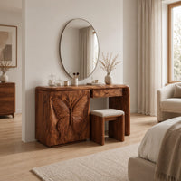 Desk style vanity with a butterfly carved cabinet and a single drawer in a Scandinavian bedroom with white walls