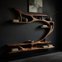 Branching wall TV shelf system in carved wood, three-quarter view showing the grain