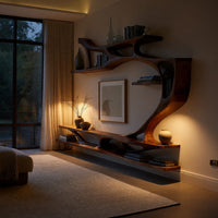 Branching wall TV shelf system in carved wood in an evening room lit by two lamps