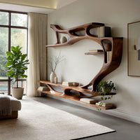Branching wall TV shelf system in carved wood in a sunlit room with large windows and plants