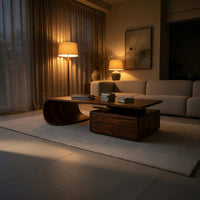 Cantilever coffee table with a two drawer box base in an evening room lit by two lamps