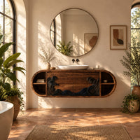 Pill shaped floating bathroom vanity with a black carved wave front in a bright bathroom with arched windows and plants