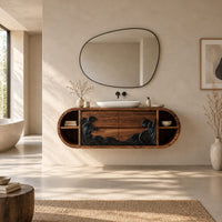 Pill shaped floating bathroom vanity with a black carved wave front in a bright open plan bathroom