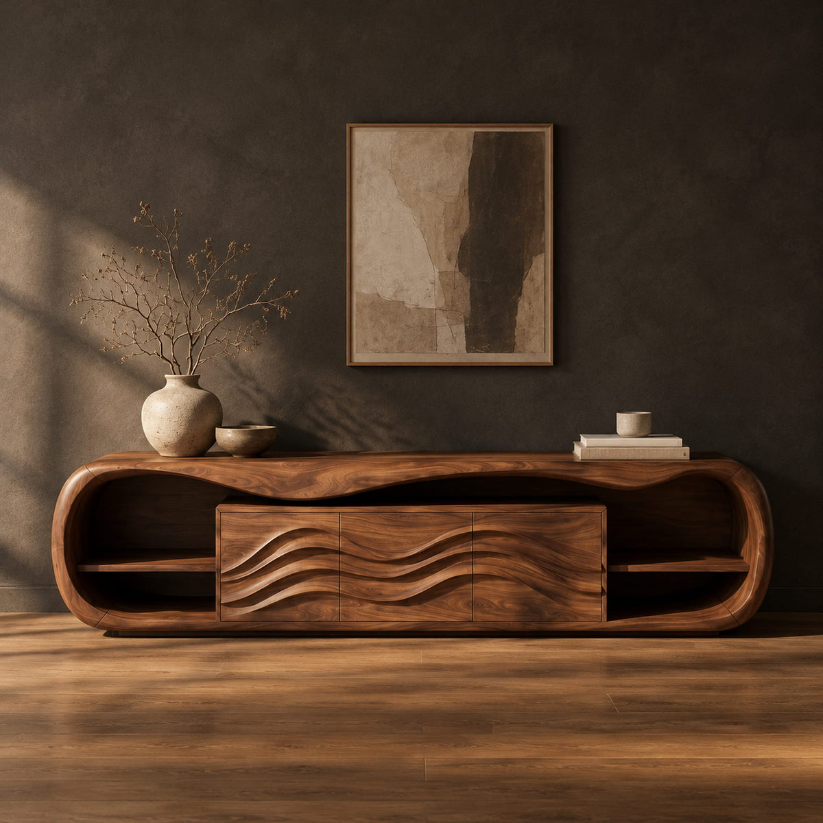 Capsule shaped tv stand with open end shelves and wave carved center panels in a dark studio against a charcoal plaster wall