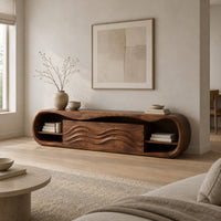 Capsule shaped tv stand with open end shelves and wave carved center panels in a Scandinavian living room with white walls