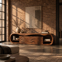 Capsule shaped tv stand with open end shelves and wave carved center panels in an industrial loft living room with exposed brick