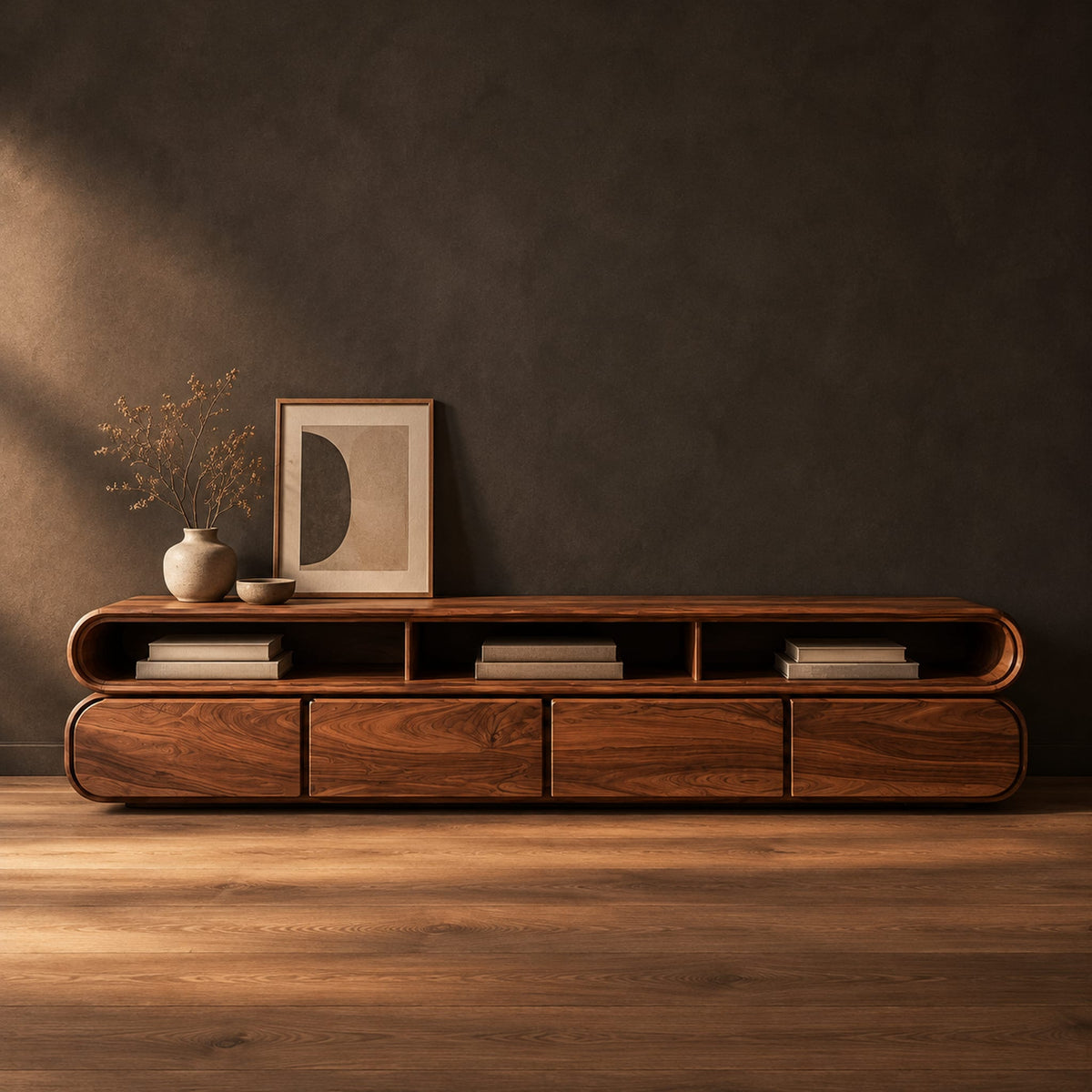 Capsule shaped tv stand with curved ends and open top bays in a dark studio against a charcoal plaster wall
